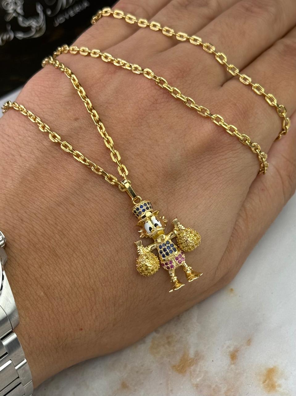 Dije Tío Rico McPato en Oro de 18K