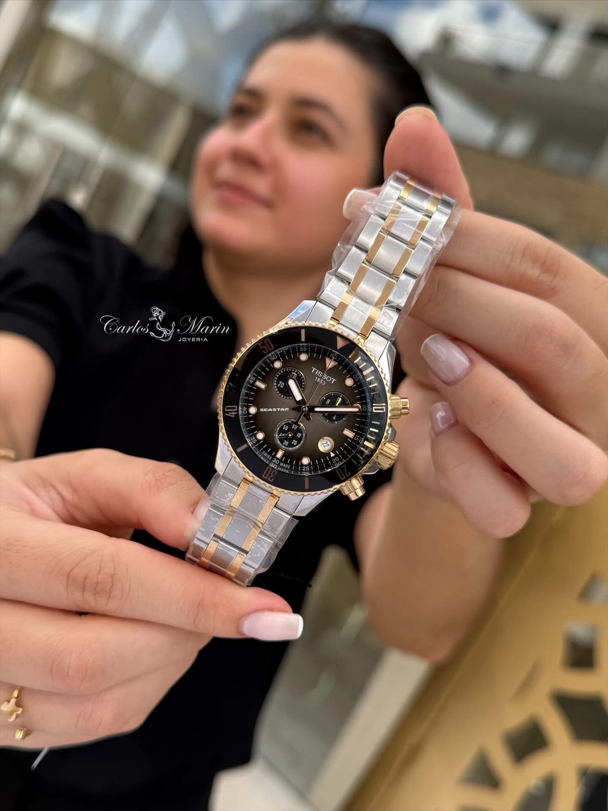 Reloj Tissot Seastar unisex negro bicolor T120.217.22