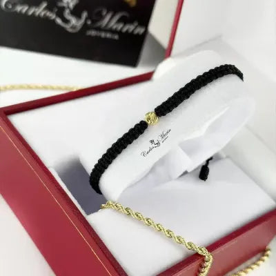Pulsera Tejido Negro Con un balin #6 en Oro 18K