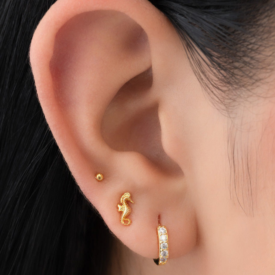 Topos Caballito de Mar Oro Laminado