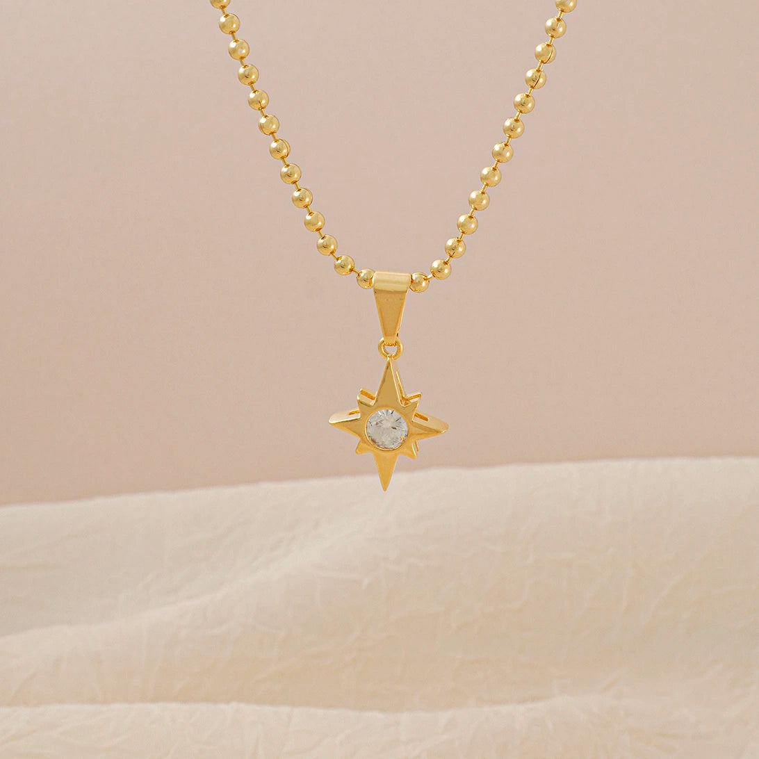 Dije Estrella con Circonia Cristal en Oro Laminado