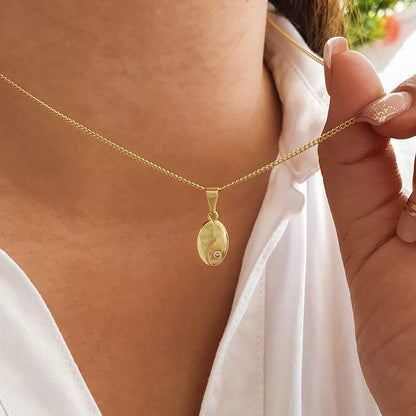 Dije Grano de Café Cristal en Oro Laminado