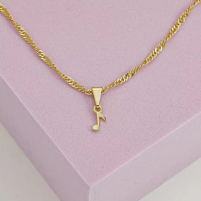 Dije Corchea en Oro Laminado