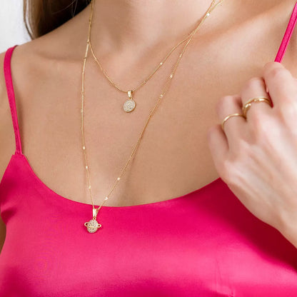 Dije Saturn con Circonias Cristal en Oro Laminado
