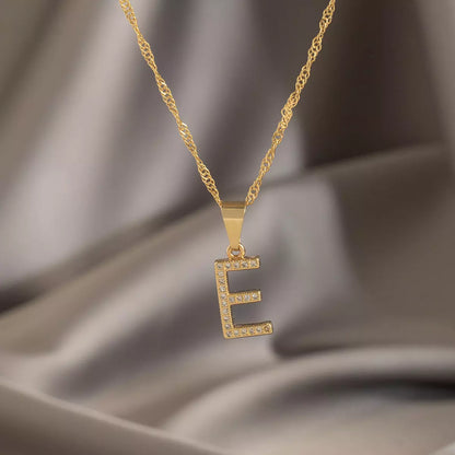 Dije Letras E en Oro Laminado