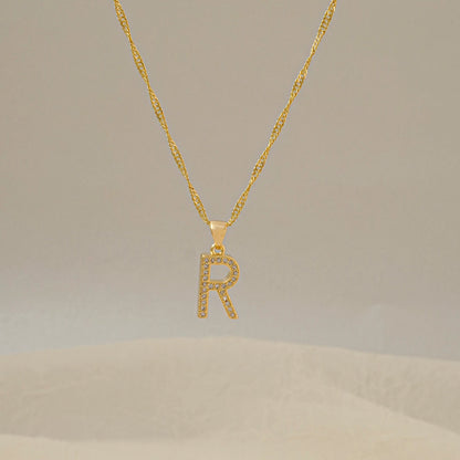 Dije Letras R en Oro Laminado