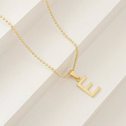 Dije Letras E en Oro Laminado