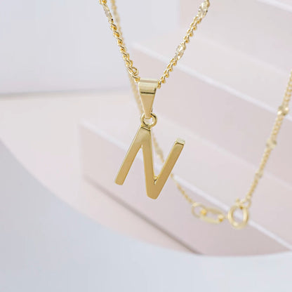 Dije Letras N en Oro Laminado