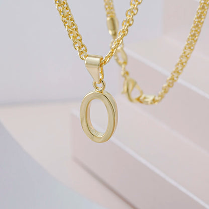 Dije Letras O en Oro Laminado