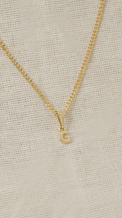 Dije Letras G en Oro Laminado