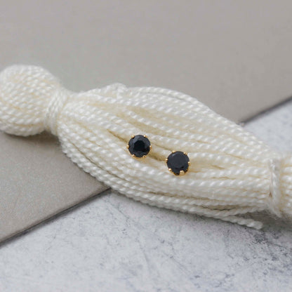 Topos Circon Redondo Negro Oro Laminado