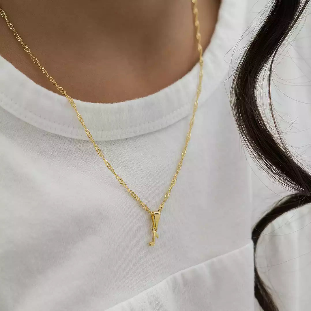 Dije Corchea en Oro Laminado