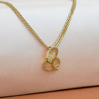 Dije Snake en Oro Laminado