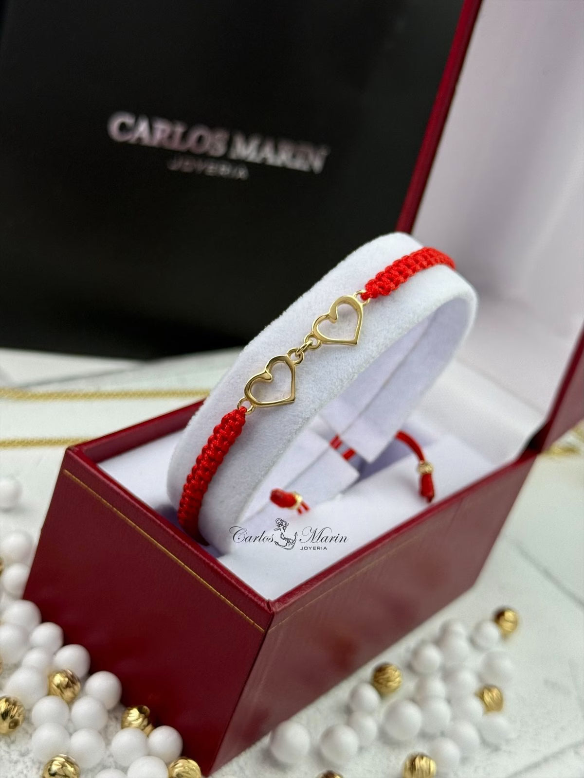 Pulsera Tejido Rojo con Herraje de dos corazones en Oro 18K