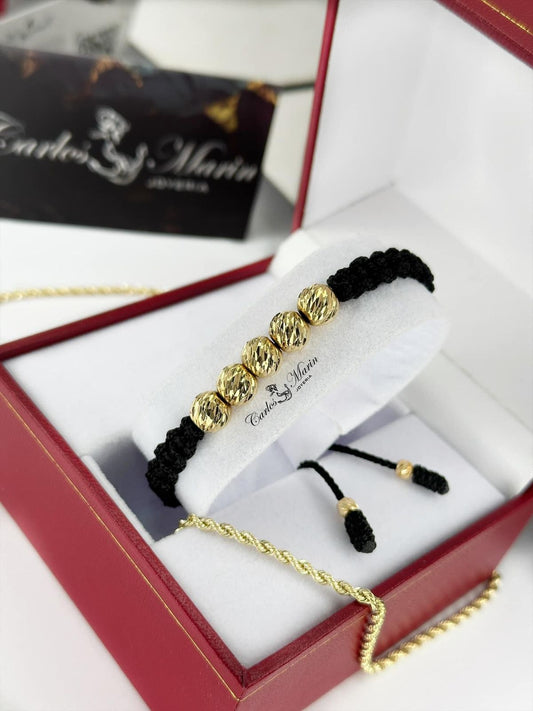 Pulsera tejida con 5 balines #8 diamantados en oro 18K elegante