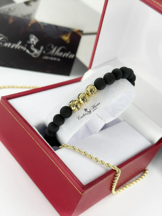 Pulsera tejida con 3 balines #8 diamantados en oro 18K elegante