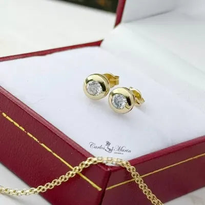 TOPOS CIRCON BLANCO EN ORO DE 18K -