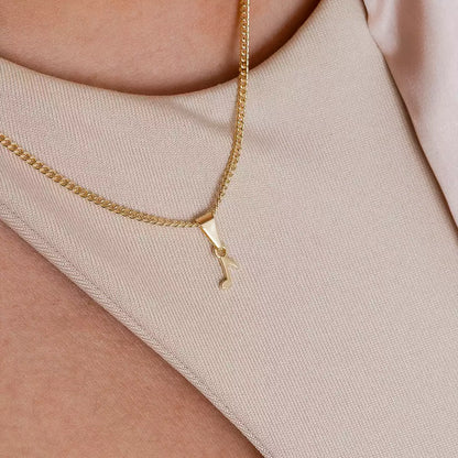 Dije Corchea en Oro Laminado